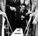 File pic: July 1978. Sam Gulle at the graveside of his family is supported by friends as the body of his 4-week old son ...