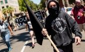 Anti-fascist counter-protesters parade through Sacramento.