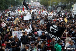 Demonstrators take part on a protest against a fuel price hike in Mexico City, Mexico, Jan. 9, 2017.