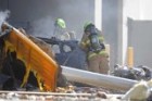 Five people were killed when the light plane crashed into a Melbourne factory outlet.