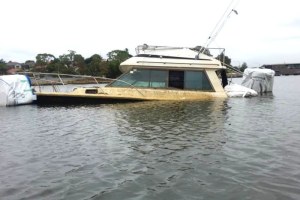 An abandoned boat submerged in the Parramatta River near Haberfield in January (Supplied: Peter Lazareff)