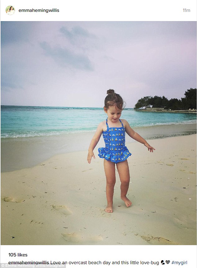 'Overcast beach day': Mom Emma shared snaps of her daughters as they played