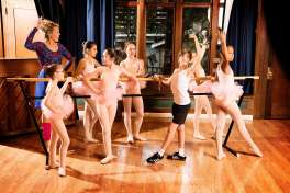 Billy Elliot (Parker James Fullmore) stands out from the crowd with the ballet girls and Mrs. Wilkinson (Taylor Bartolucci) in Berkeley Playhouse's ��Billy Elliot.�