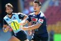 Jackson Garden-Bachop passes the ball during the match between the New South Wales Waratahs and Melbourne Rebels on ...