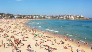 Bondi Beach is crowded with a large number of beachgoers on a hot Sunday afternoon. Bondi Beach is crowded with a large ...