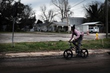 Teenager rides bike in Mississippi (Getty Images: Spencer Platt / Staff)