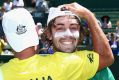 Jordan Thompson of Australia is congratulated after winning the tie against the Czech Republic.