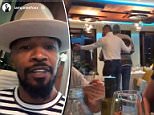 Croatian police have filed charges against two people who allegedly used a racial slur to insult Hollywood actor Foxx in a restaurant. Foxx is seen left and the diners are seen being led away, right in a video initially shared to Instagram