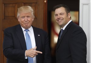 President-elect Donald Trump greets Kansas Secretary of State, Kris Kobach, as he arrive at the Trump National Golf Club Bedminster clubhouse, Sunday, Nov. 20, 2016, in Bedminster, N.J.