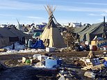 In this Thursday, Feb. 16, 2017, photo, debris is piled on the ground awaiting pickup by cleanup crews at the Dakota Access oil pipeline protest camp in southern North Dakota near Cannon Ball. The camp is on federal land, and authorities have told occupants to leave by Wednesday, Feb. 22 in advance of spring flooding. (AP Photo/Blake Nicholson)