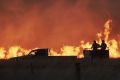 Farmers battle a fire near Cassilis in the central west of New South Wales.