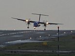 Flybe flight BE729 from Belfast arrives through cross-winds at Leeds Bradford Airport today, hours before Storm Doris hits