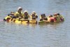 Children practicing safety skills in water.