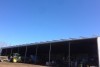 Wide view of solar panels on top of a shed.