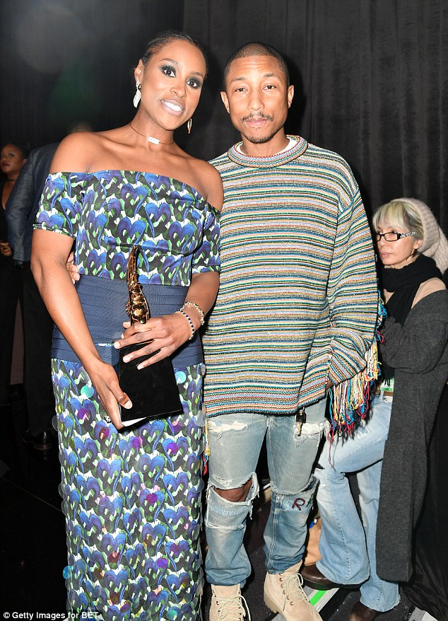 Star-studded: Pharrell posed alongside Issa Rae who was recognised with the 'Rising Star Award'