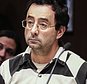 FILE - In this Friday, Feb. 17, 2017, file photo, Dr. Larry Nassar listens to testimony of a witness during a preliminary hearing, in Lansing, Mich. The former sports doctor at Michigan State University who specialized in treating gymnasts has been charged with sexual assault. Dr. Nassar was charged Wednesday, Feb. 22,  in two Michigan counties. Online records show he's facing nine charges in Ingham county, including first-degree criminal sexual conduct against a victim under age 13. Nassar had a clinic at Michigan State, where he treated members of the gymnastics team and younger regional gymnasts. (Robert Killips/Lansing State Journal via AP, File)