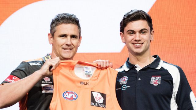 GWS Giants coach Leon Cameron poses with the number two draft pick TIm Taranto.