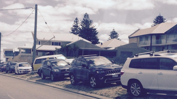 Cars parked near the beach at Trigg.