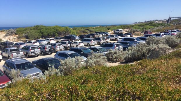 Just sun, sand and a sea... of cars at Leighton.