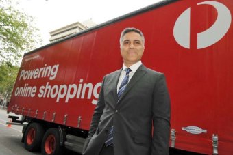 Australia Post chief executive Ahmed Fahour stands in front of an Australia Post truck.