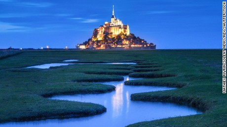 RESTRICTED 

Mandatory Credit: Photo by Mathieu Rivrin/Solent News/REX/Shutterstock (7655013f)
The abbey at Mont Saint Michel
Double Rainbows at The abbey at Mont Saint Michel
The abbey at Mont Saint Michel, an island community in Normandy, France, looks magical as two double rainbows appear on either side of it after a heavy rainfall. Mont Saint Michel is a popular attraction in France and is classed as an UNESCO world heritage site. Some 40 to 50 people live in the city, which also has a mayor and sees more than a million tourists visit each year.

Mont Saint Michel is around 1km off France&#39;s northwestern coast. During low tides, the medieval walled city is accessible with people able to walk and visit the abbey, which resembles a fairytale castle. But during high tide, it is transformed into an island.

Photographer Mathieu Rivrin, 27, travelled three hours from his home in Brest, France, to take photographs of the stunning area.
He said: &quot;I&#39;ve been waiting for very particular weather conditions as I had an image in mind that I really wanted to photograph.
&quot;It included rainbows or something during a very beautiful &#39;blue&#39; hour which is the hour right after sunset so I was very happy when I managed to take these photos. It&#39;s such a beautiful location to take pictures - from the earth or from the sky. I was really excited when I saw the double rainbow. I ran very, very fast to a location where I would have a rainbow on either side of Mont Saint Michel, it was a really thrilling moment.&quot;

&quot;For the &#39;blue&#39; hour after sunset, I organised a flight on a microlight aircraft. The day of the flight it had been raining heavily all day and the light appeared only for the flight which was lucky but very stressful. I had dreamt of the image I managed to get of Mont Saint Michel lit up, the deep blue skies and the reflection of the wavy stream.&quot;

&quot;The blue hour is the golden hour to me because of the delicious contr...
For more information visit http://www.rexfeatures.com/stackli