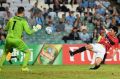 Alert: Yuki Muto fires wide of Janjetovic during the visit of Urawa to Sydney last year. 