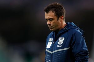 Kelly is negotiating a deal for premiership coach Chris Scott at Geelong and opposes any six-month payout clause.