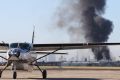 A plume of smoke from the crash at Essendon Airport on Tuesday. 