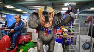 MAINZ, GERMANY - FEBRUARY 21: MCV worker Andre Menager works on a carnival float featuring an effigy of U.S. President ...
