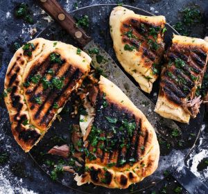 Char-grilled calzone stuffed with ajvar and slow-cooked pork.