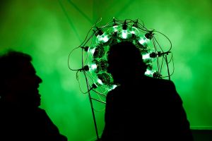 Visitors talk with a member of staff at the ARCO International Art Fair in Madrid, Spain, Wednesday, Feb. 22, 2017 . ...