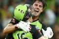 Nailbiter: Pat Cummins embraces Eoin Morgan after the Sydney Thunder's thrilling BBL win over the Melbourne Stars.