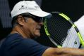 Spain's Rafael Nadal (right) with his uncle Toni Nadal (left) as Carlos Moya looks on.