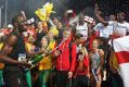 Usain Bolt celebrates with champagne.