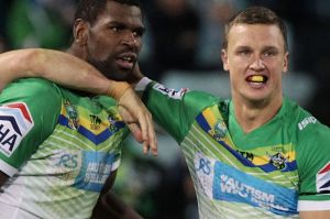 CANBERRA, AUSTRALIA - MAY 29: Edrick Lee of the Raiders is congratulated by team mates after scoring a try during the ...