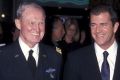 Lieutenant-General Harold G. Moore and actor Mel Gibson attend the We Were Soldiers premiere in 2002.