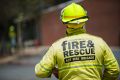 Fire fighters are searching an evacuated building in Belconnen for signs of smoke or fire. 