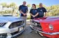 Canberra Mustang club members, from left, Mick Dainer, Sue Vilardi and Dominic Vilardi, with their cars. Mr Dainer owns ...