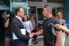 Greg Hunt shakes hands with Rick Pate