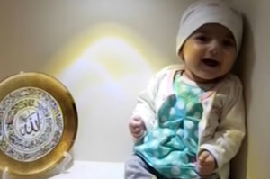 Fatemeh Reshad is travelling to the United States for heart surgery. The display dish on the left has the word "Allah" ...