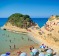 Visit a quiet, secluded beach with 1000 of your close friends in Corfu.