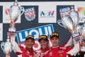 Controlled aggression: Toni Vilander, Craig Lowndes and Jamie Whincup celebrate the win.