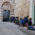 Palestinian men and boys, praying outside al-Ibrahimi mosque