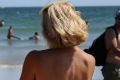 Women go topless on Hampton Beach, New Hampshire, for GoTopless Day in August. The US national day promotes gender ...
