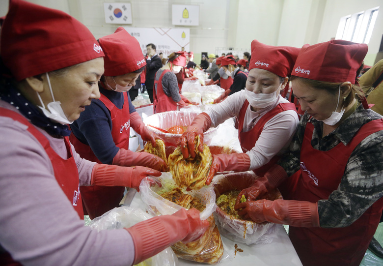 FILE – In this Oct. 28, 2015 file photo, housewives make kimchi, traditional pungent vegetable, to donate to needy neighbors for winter preparation at a government building in Seoul, South Korea. While most people born in rich countries will live longer by 2030, with women in South Korea projected to reach nearly 91, Americans will continue to have one of the lowest life expectancies of any developed country, a new study published online Tuesday, Feb. 21, 2017 predicts. (AP Photo/Ahn Young-joon, File)