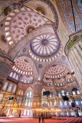 A couple of tourists taking in the size and grandeur of the stunning Blue Mosque, Istanbul.