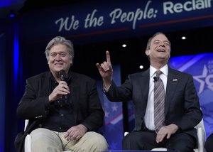 White House Chief of Staff Reince Priebus, right, accompanied by White House strategist Stephen Bannon, speaks at the Conservative Political Action Conference (CPAC) in Oxon Hill, Md., Thursday, Feb. 23, 2017.