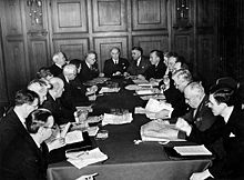 Pictured from Left to Right C.S. Ritchie, P.E. Renaud, Elizabeth MacCallum, Lucien Moraud, Escott Reid, W.F. Chipman, Lester Pearson, J.H. King, Louis St. Laurent, Rt. Hon. W.L. Mackenzie King, Gordon Graydon, M.J. Coldwell, Cora Casselman, Jean Desy, Hume Wrong, Louis Rasminsky, L.D. Wilgress, M.A. Pope, R. Chaput