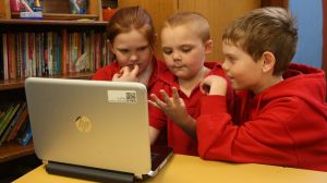 School children work off a computer at Darlington Public School. 