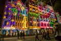 Happy return: Visitors oohed as  projections lit up Flinders Street from 9pm.